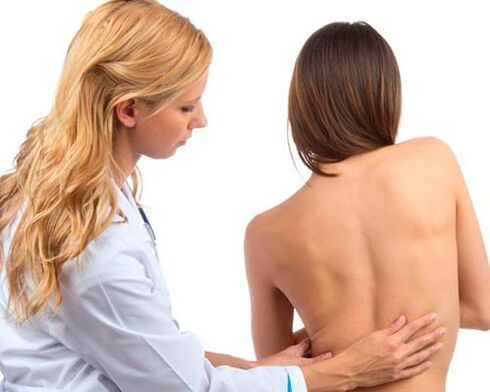 doctor examining your back for back pain